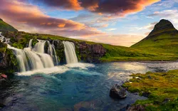 Summer sunset on famous Kirkjufellsfoss Waterfall and Kirkjufell